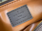 Louis Vuitton bag interior leather label with dark stitching and embossed logo