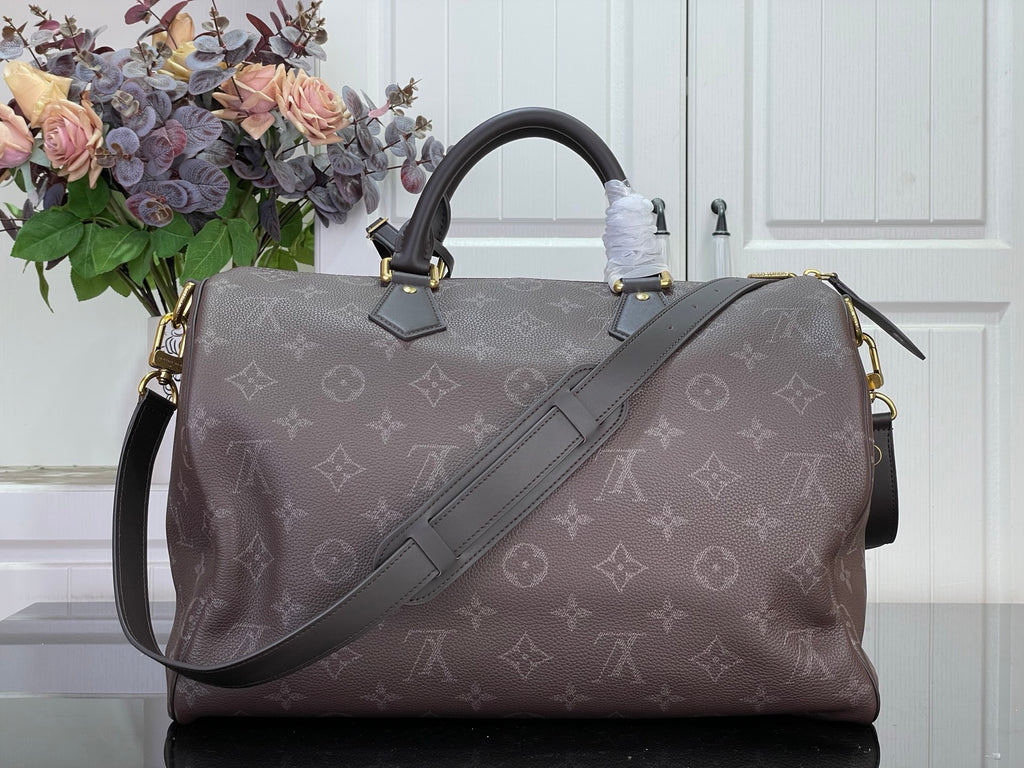 Louis Vuitton monogram tote bag with adjustable shoulder strap and top handles