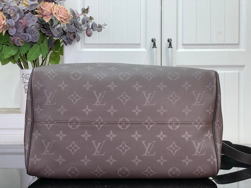 Louis Vuitton monogram duffle bag with zipper top and wide front panel