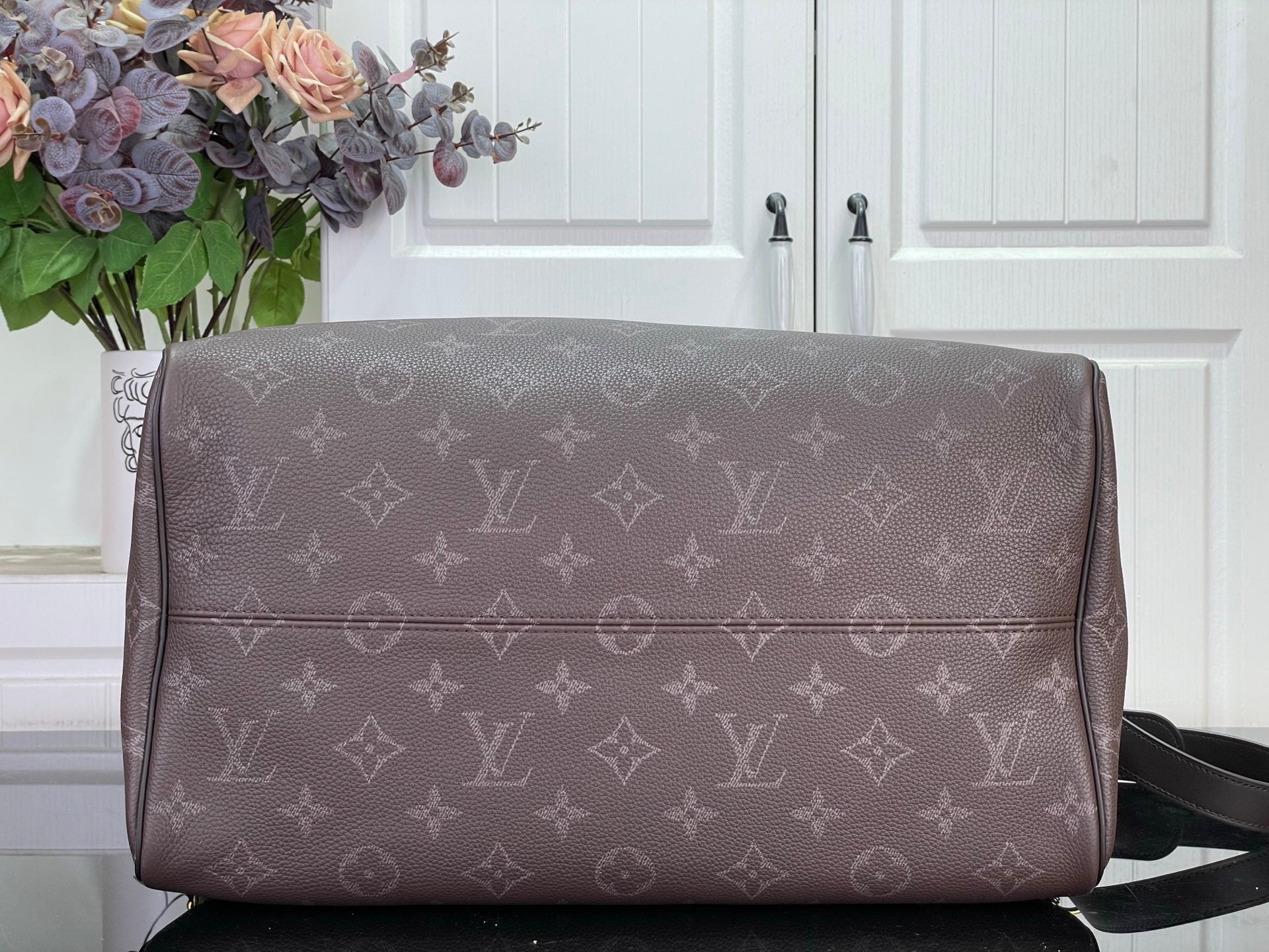 Louis Vuitton monogram duffle bag with zipper top and wide front panel