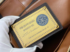 Louis Vuitton bag authenticity label card with text inside tan pocket lining