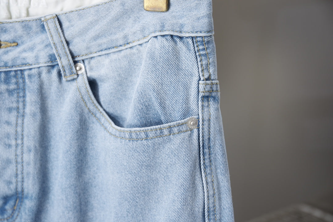 Light blue denim pants front pocket and buttoned waistband details