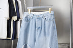 Light blue denim pants with front button closure and belt loops
