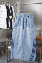 Light blue denim cargo pants with two front flap pockets and adjustable waistband