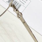 Gucci eyeglasses hinge close-up with metal temple arm and logo detail