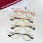 Gucci eyeglasses set of three with gold frames and blue accent temple tips
