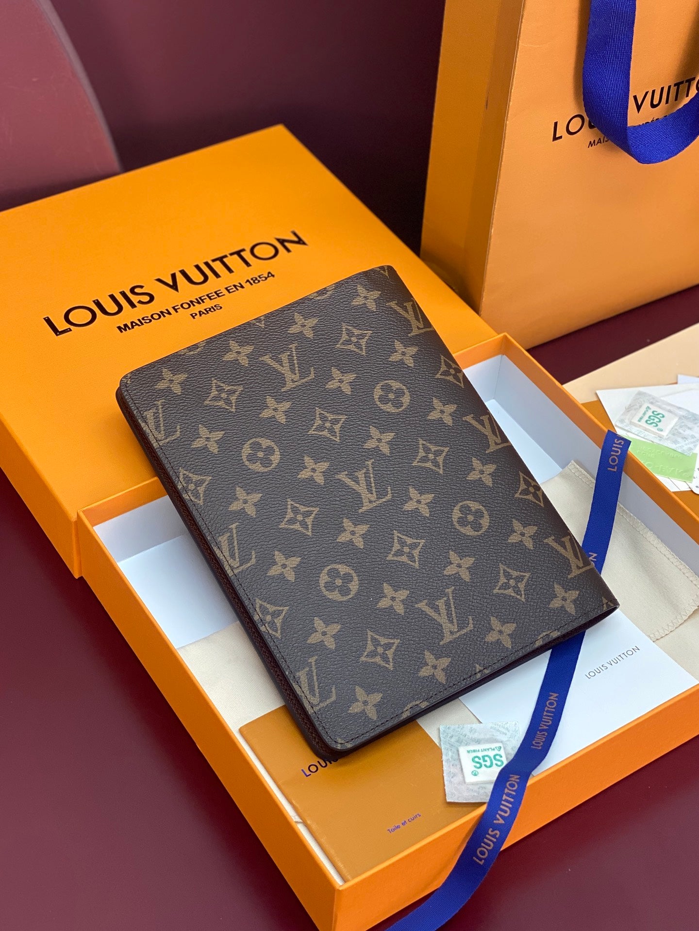 Louis Vuitton monogram canvas wallet, brown repeating LV pattern, in gift box.
