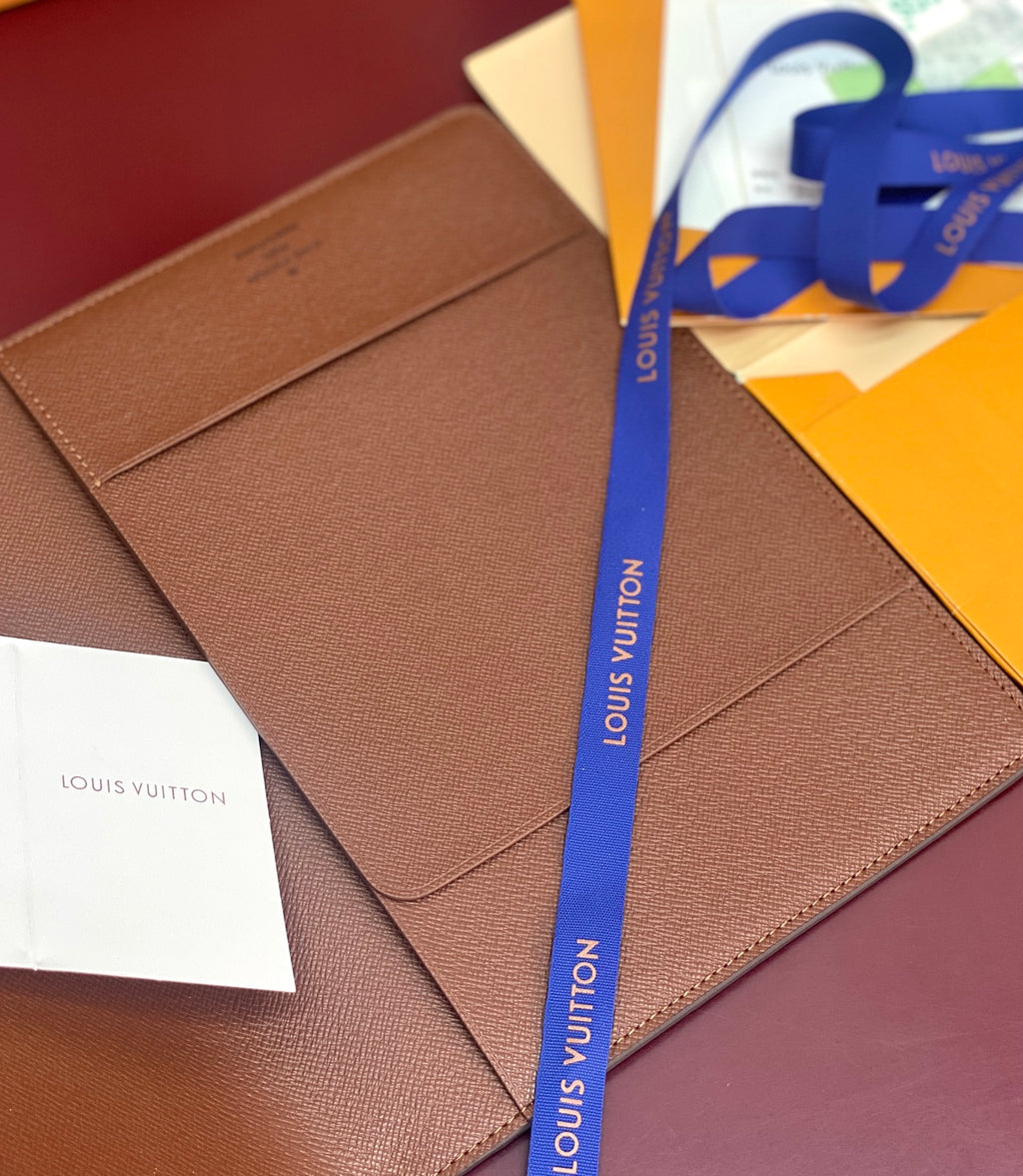 Louis Vuitton small brown leather wallet with smooth front and paper inserts