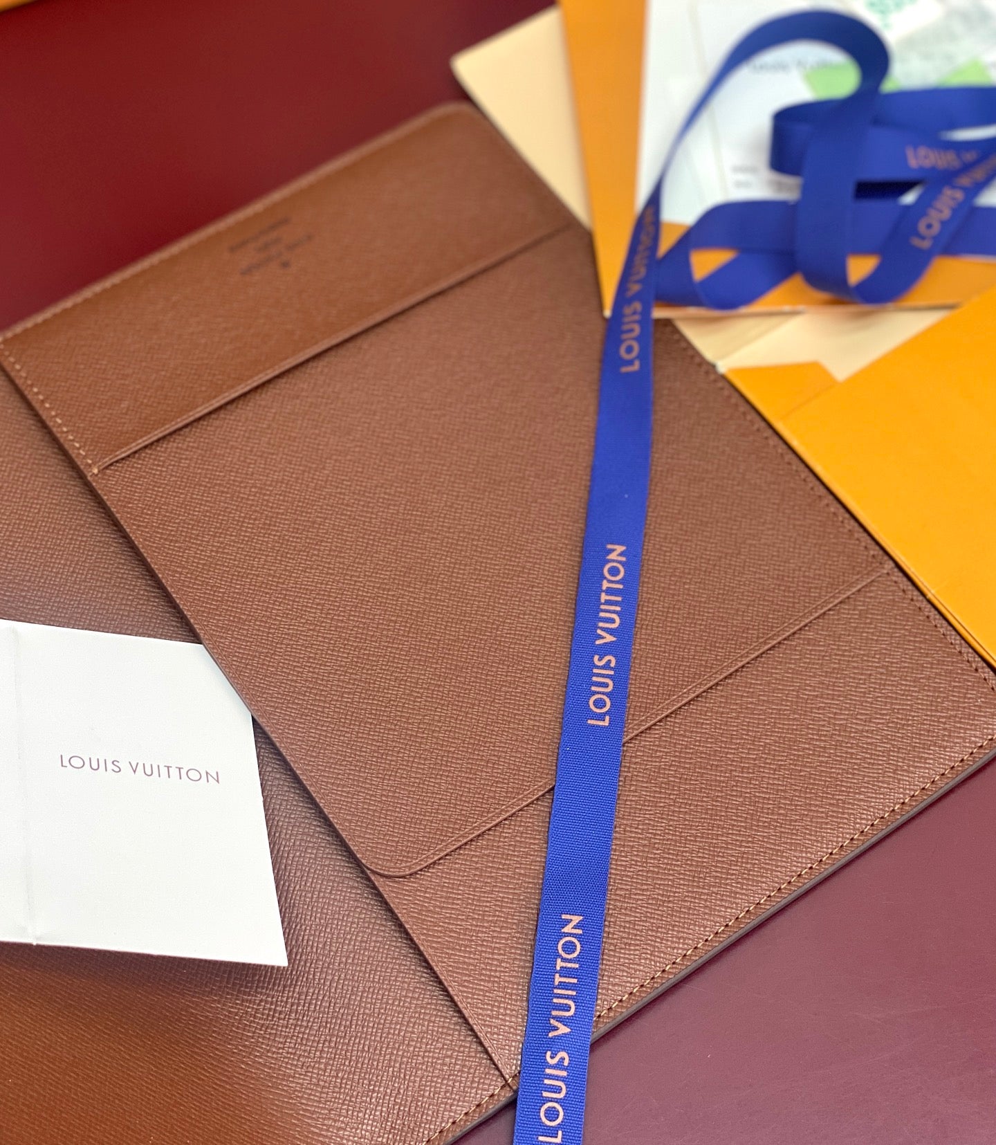 Louis Vuitton small brown leather wallet with smooth front and paper inserts