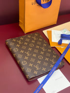 Louis Vuitton small monogram canvas wallet, angled view with leather trim
