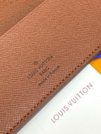 Louis Vuitton leather close-up, embossed logo and 'Made in France' text.