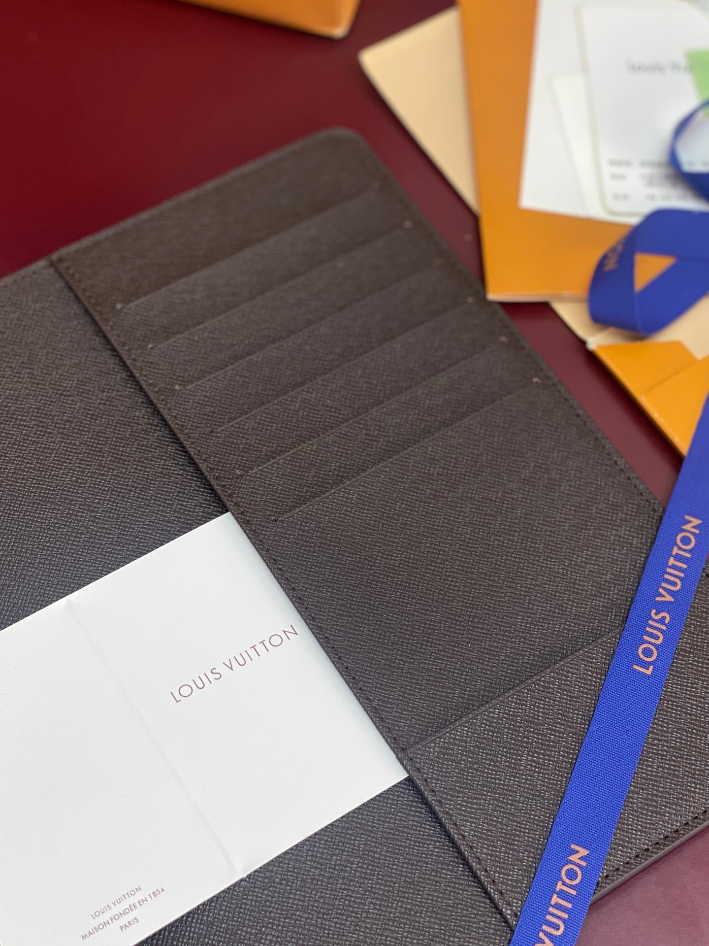 Louis Vuitton small wallet interior with dark card slots and textured lining