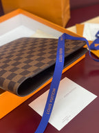 Louis Vuitton small wallet, dark brown checkered canvas with curved fold and blue ribbon