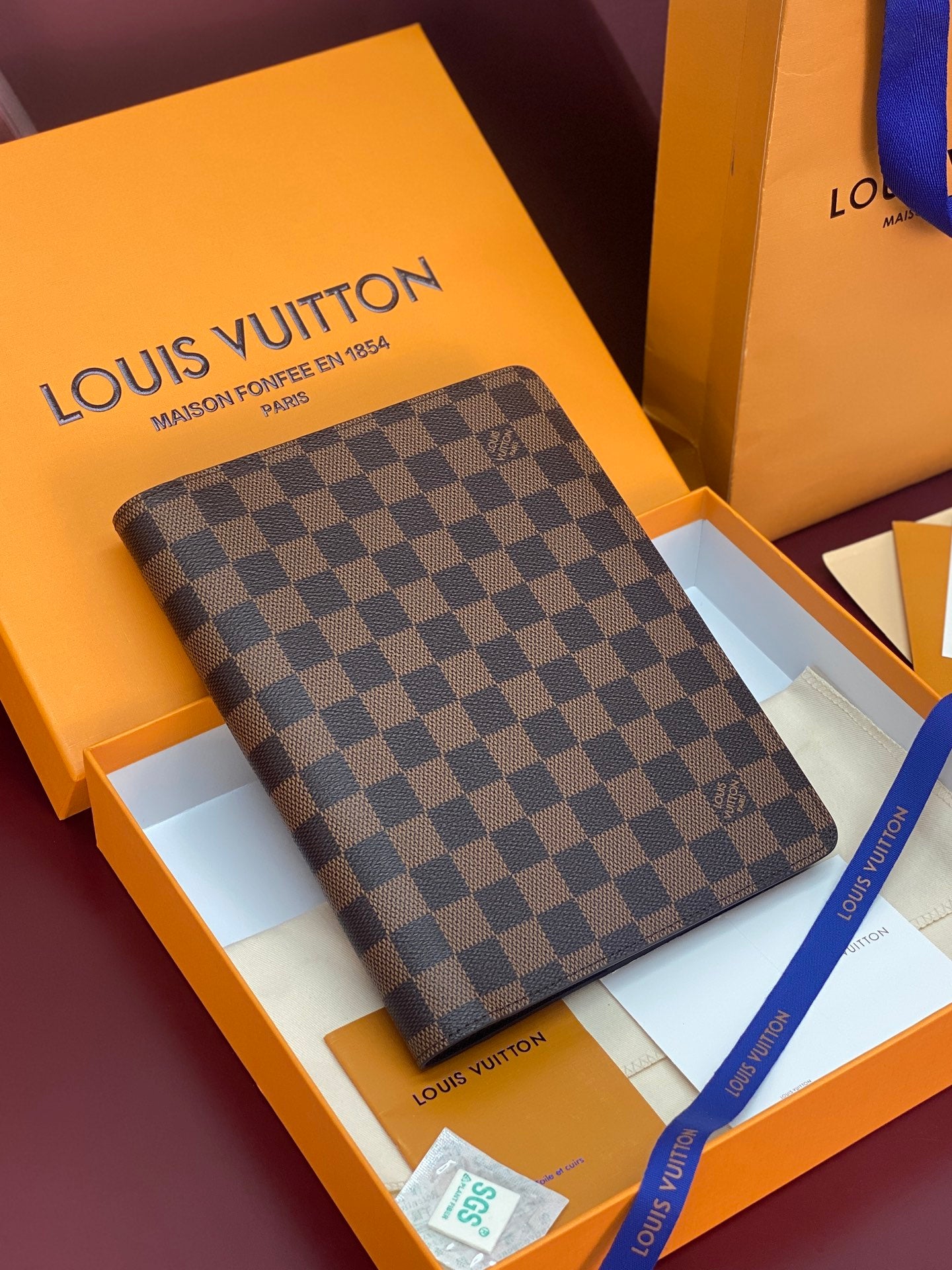 Louis Vuitton small wallet with dark brown checkered canvas and front logo plaque