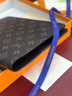 Louis Vuitton monogram card holder, dark navy canvas with blue brand ribbon