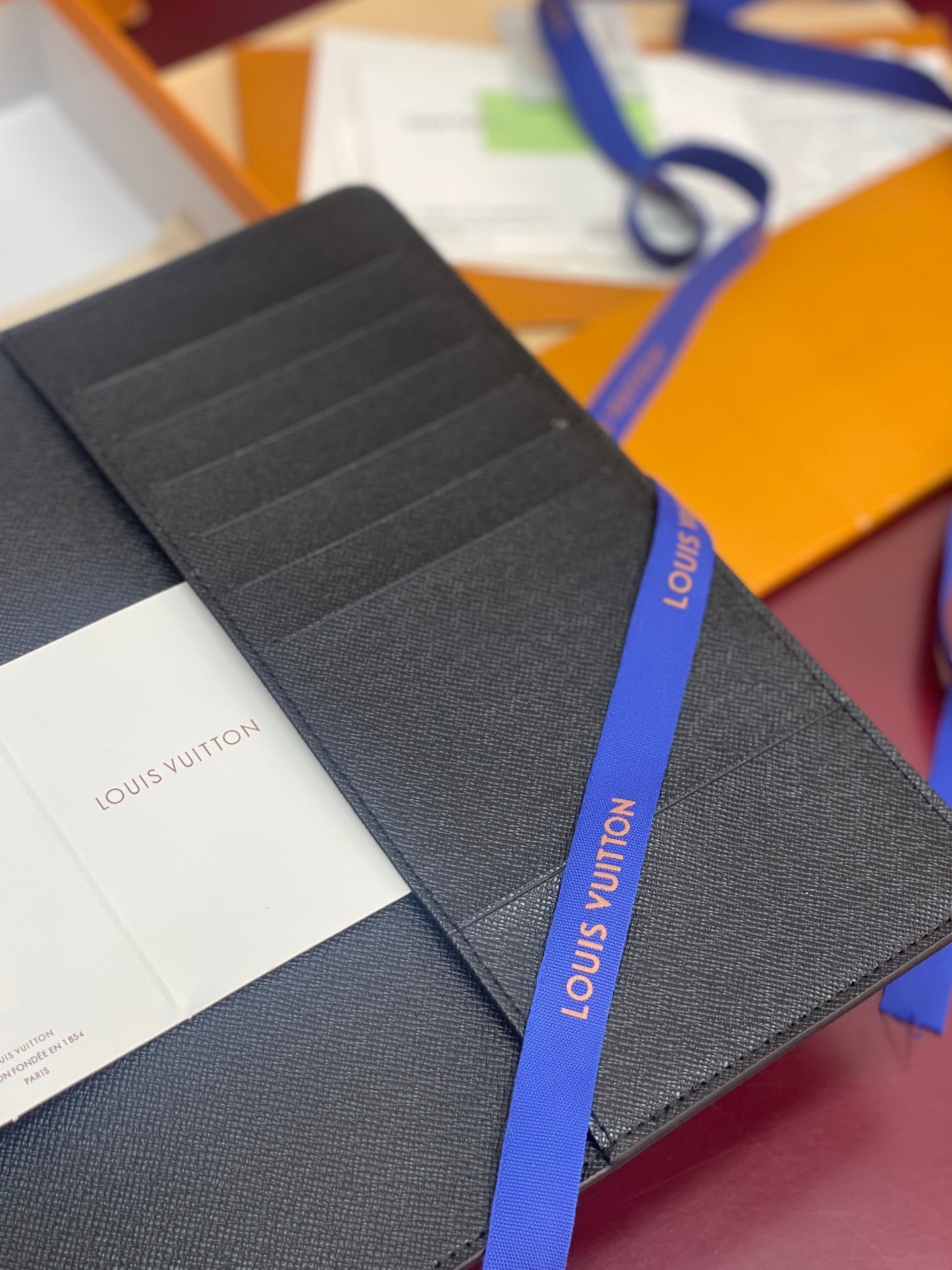 Louis Vuitton textured wallet, dark blue, with stitched card slots