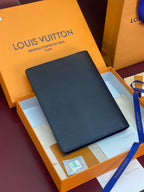 Louis Vuitton small bag, dark textured exterior with smooth edge binding