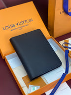 Louis Vuitton small bag, dark textured finish with slim front panel