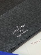 Close-up of Louis Vuitton Paris made in France on dark leather wallet