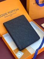 Louis Vuitton small bag, dark embossed monogram leather with front flap