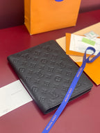 Dark monogram embossed leather small bag with flap and ribbon pull