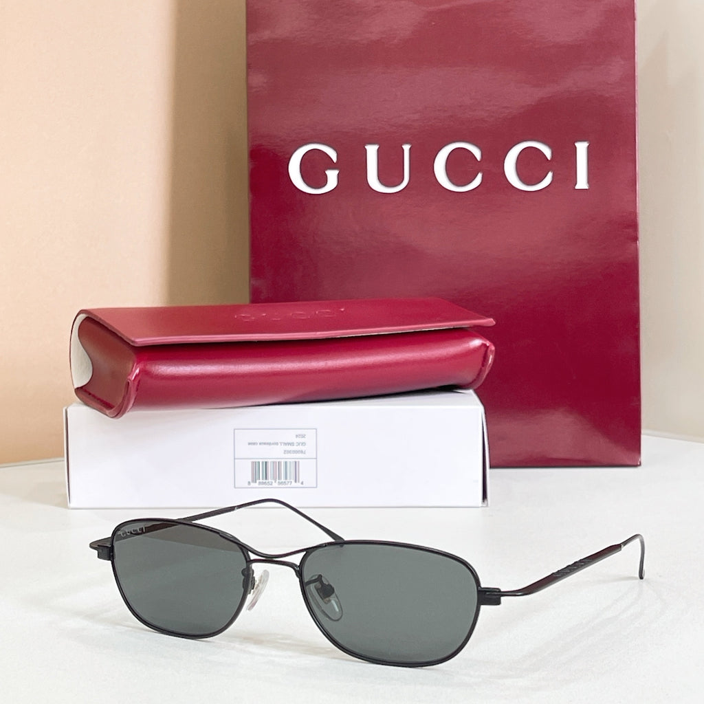 Black aviator eyeglasses with dark tinted lenses and thin metal frame