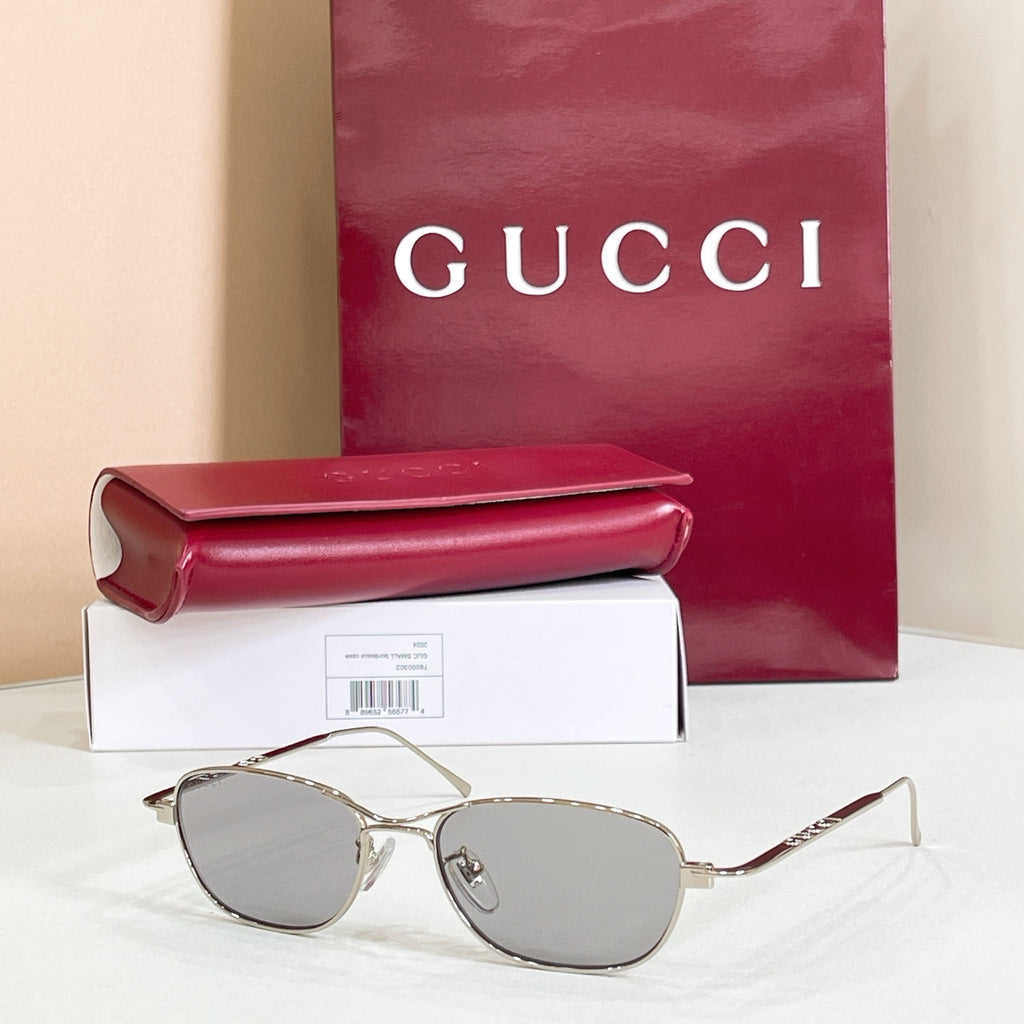 Silver-tone aviator eyeglasses with cool gray tinted lenses and thin metal frame