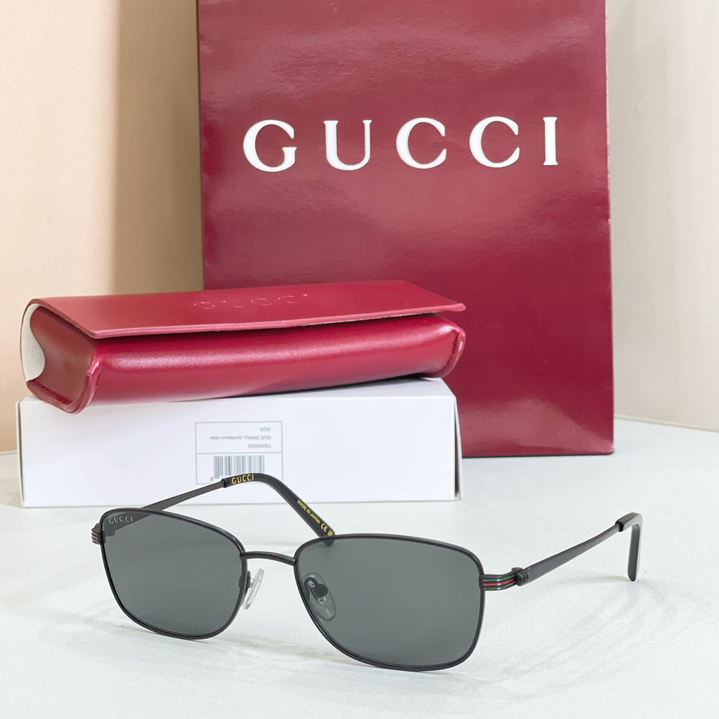 Silver-tone metal sunglasses with dark gray tinted lenses and low-profile frame
