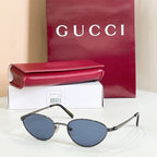 Gucci sunglasses with silver metal frame and blue-tinted lenses