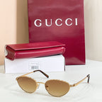 Gucci sunglasses with gold metal frame and tan lenses