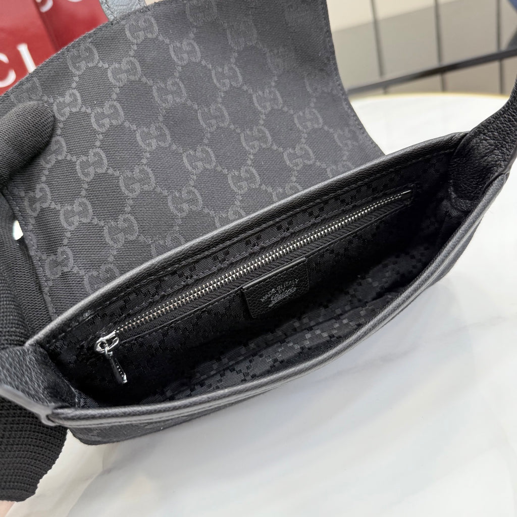 Gray Gucci mini bag interior view with zip closure and dark lined compartment.