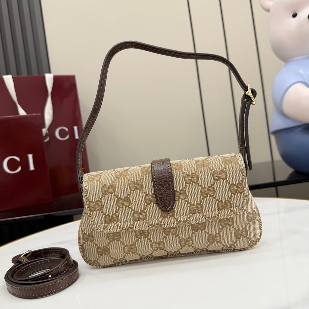 Beige GG-pattern handbag with dark brown flap, top handle, and gold-tone clasp