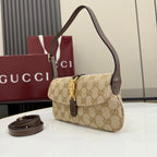 Beige GG-pattern small hobo shoulder bag with dark brown leather accents and gold clasp