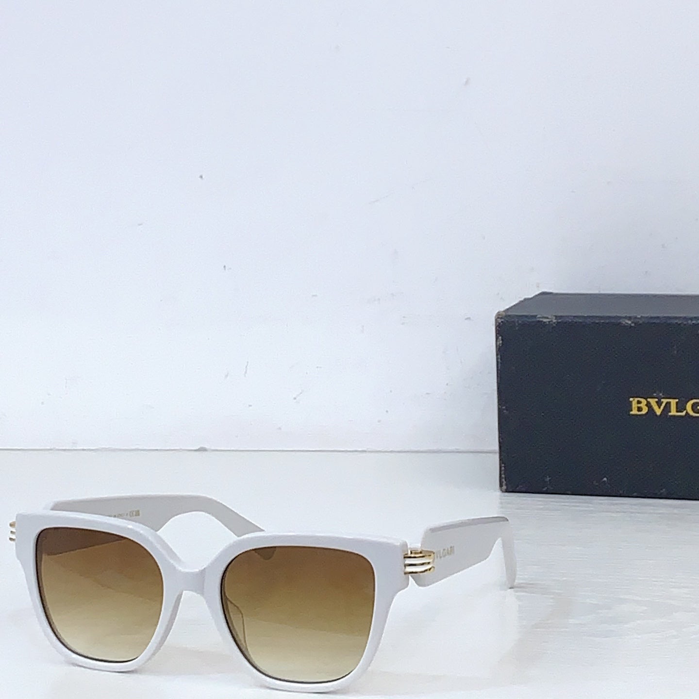 Bvlgari square sunglasses with white frame and tan tinted lenses