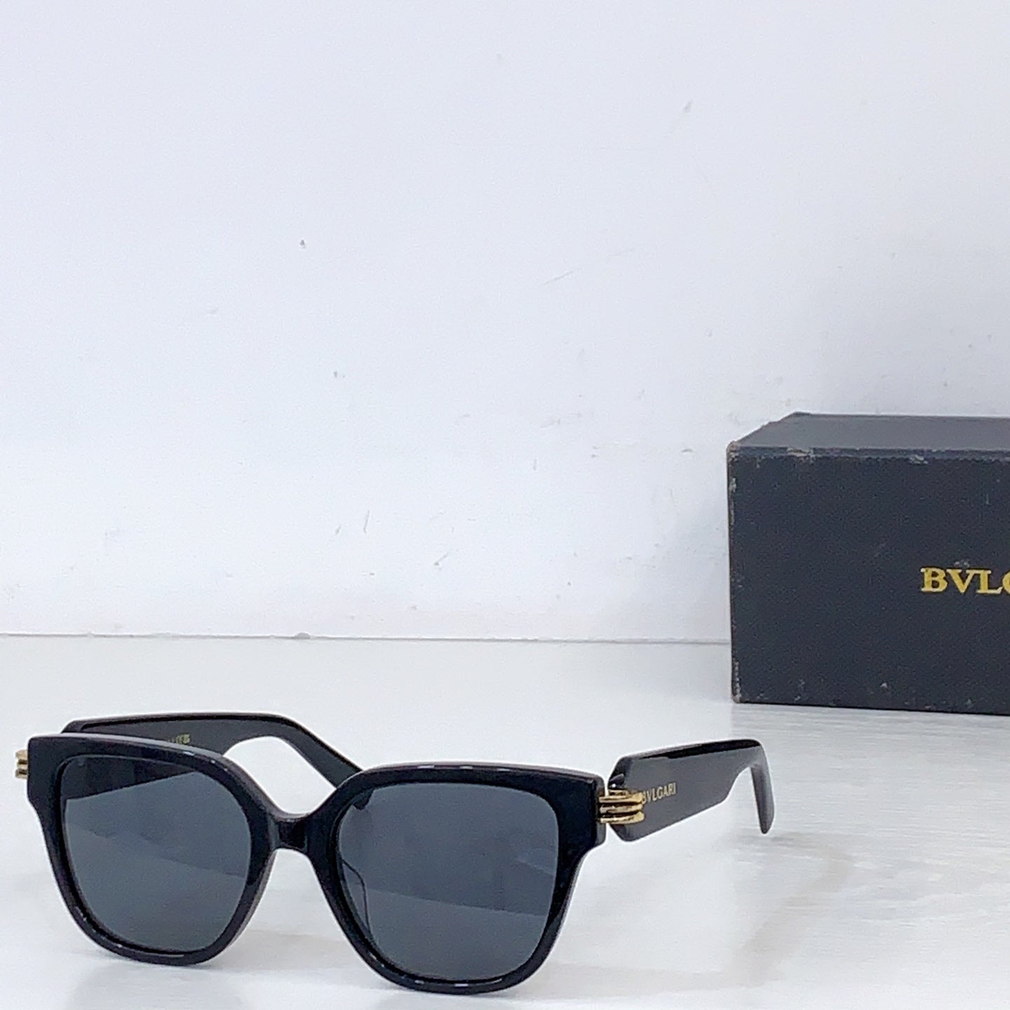 Bvlgari square sunglasses with black frame and gray-blue tinted lenses