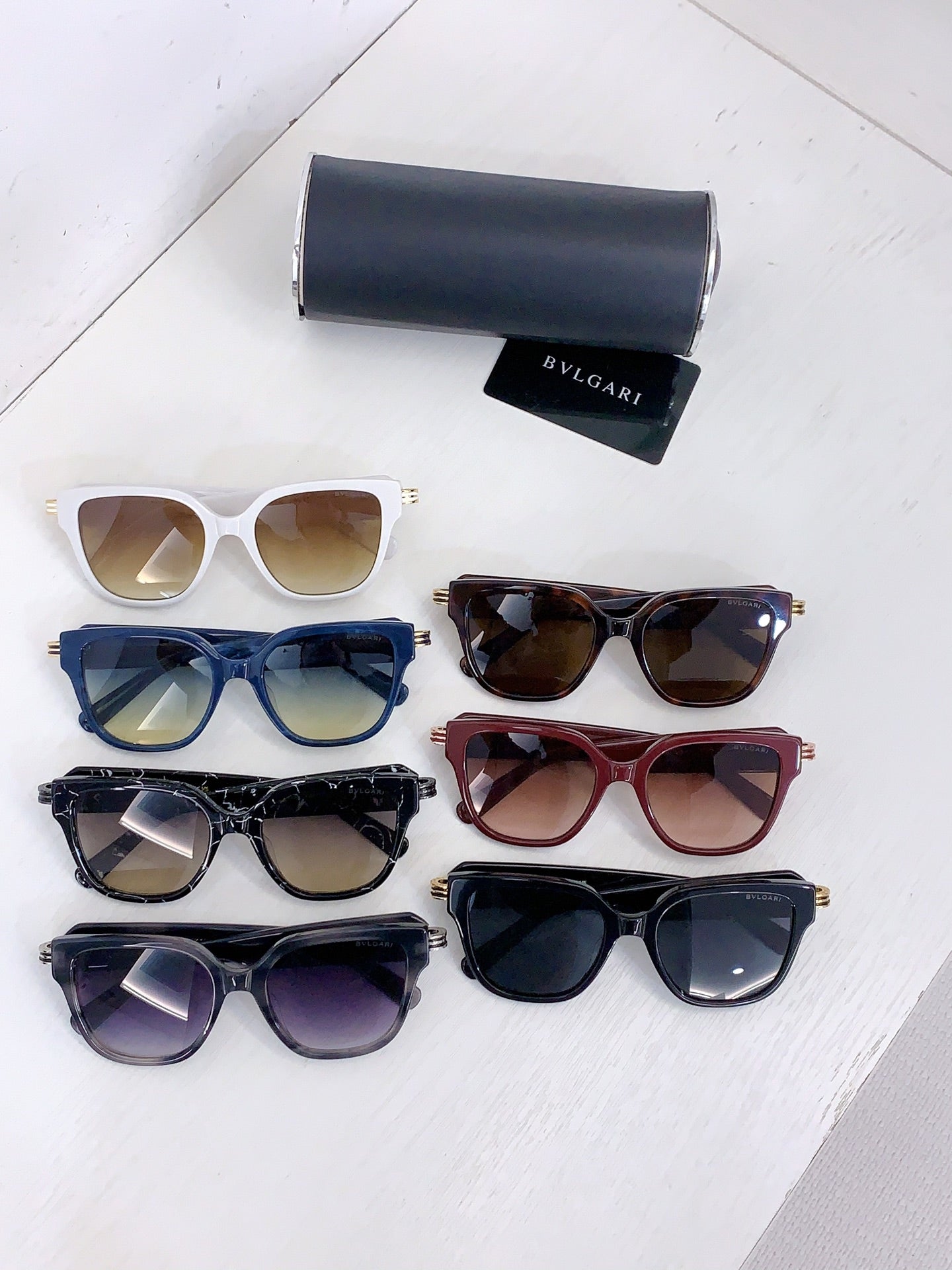 Bvlgari sunglasses set with white, blue, burgundy, black, and purple frames plus cases