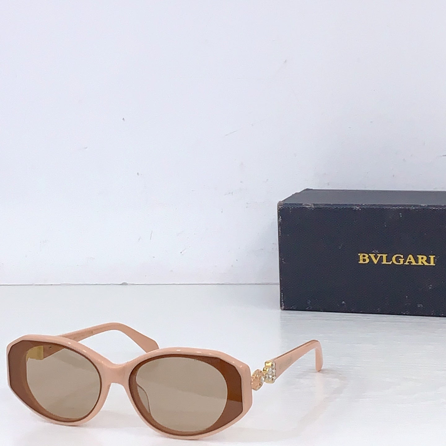 Bvlgari light pink oversized sunglasses with tan lenses and decorative hinge