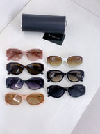 Bvlgari sunglasses assortment with multiple frame colors laid out flat