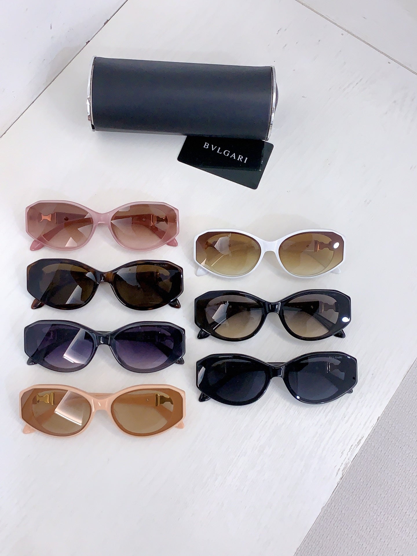 Bvlgari sunglasses assortment with multiple frame colors laid out flat
