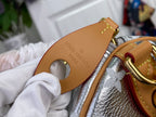 Tan leather key pouch with Louis Vuitton Paris embossed detail and gold clasp
