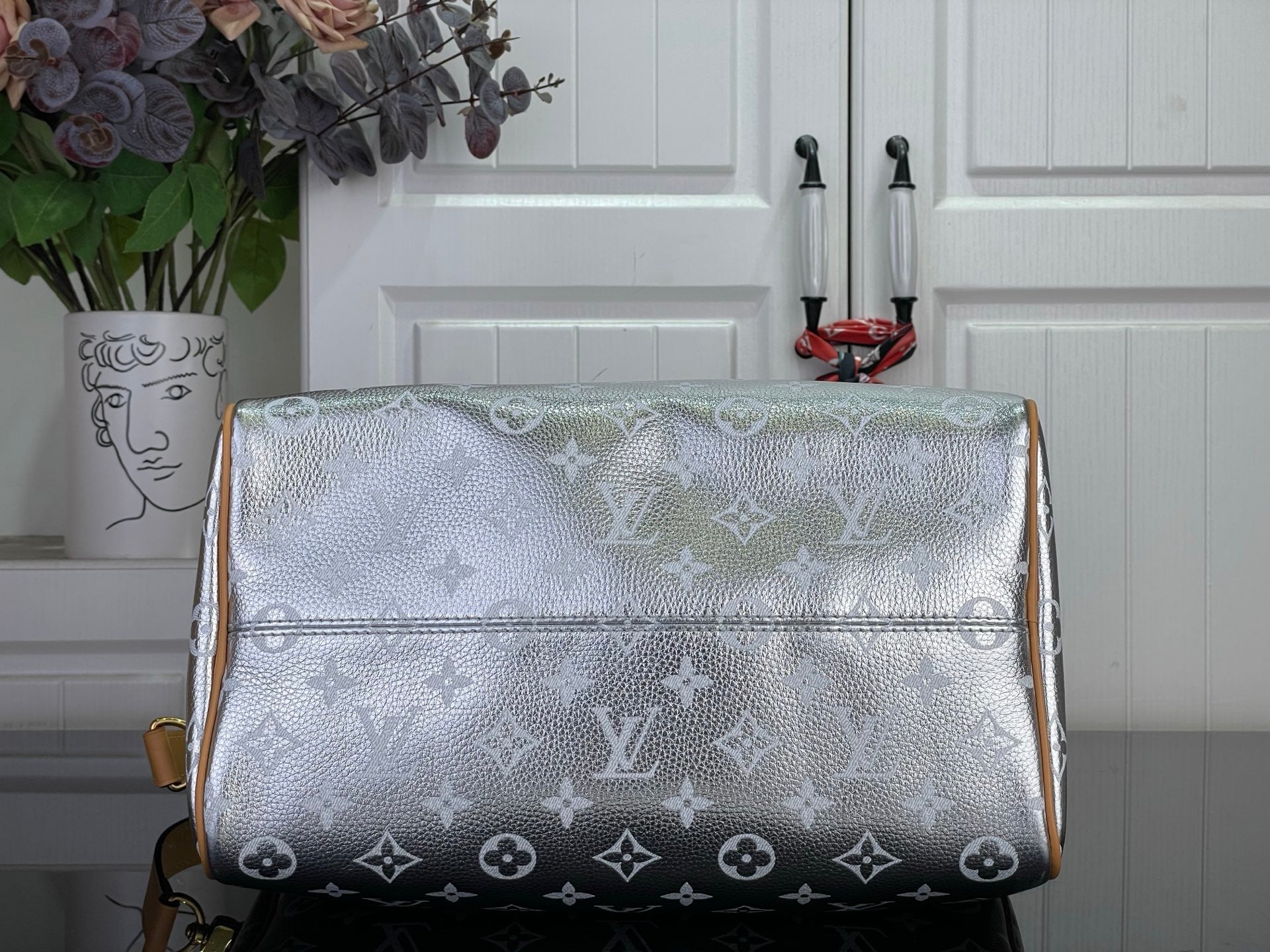 Monogram canvas duffle bag with light silver sheen and tan leather trim