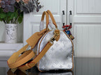 Monogram canvas shoulder bag in light silver with tan strap and leather tags