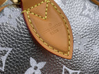 Tan leather tab with Louis Vuitton Paris imprint and yellow edge stitching