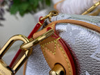 Monogram canvas bag with tan leather trim, red lining panel, and gold hardware