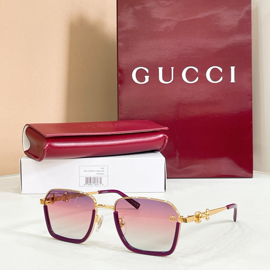 Square sunglasses with purple tinted lenses, gold frame, and gold metal hinges