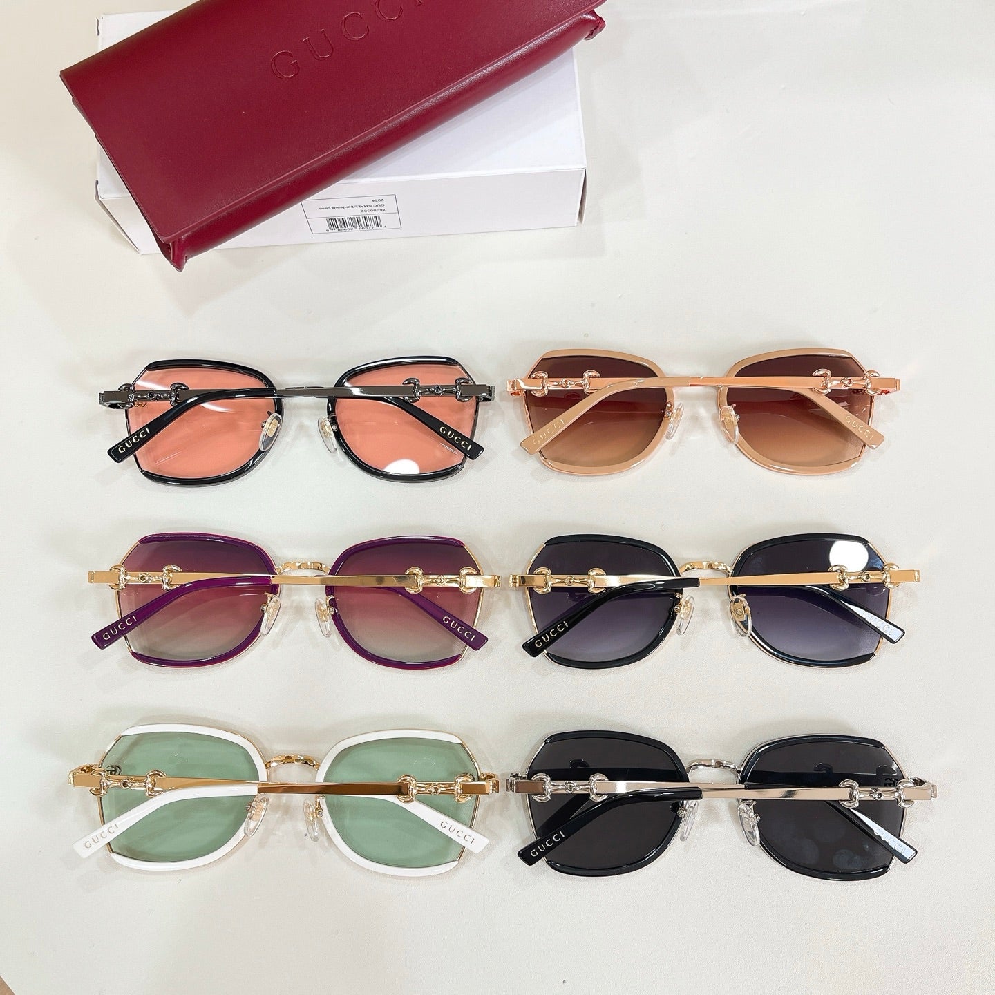 Mixed round sunglasses set with pink, purple, green, and dark lenses.