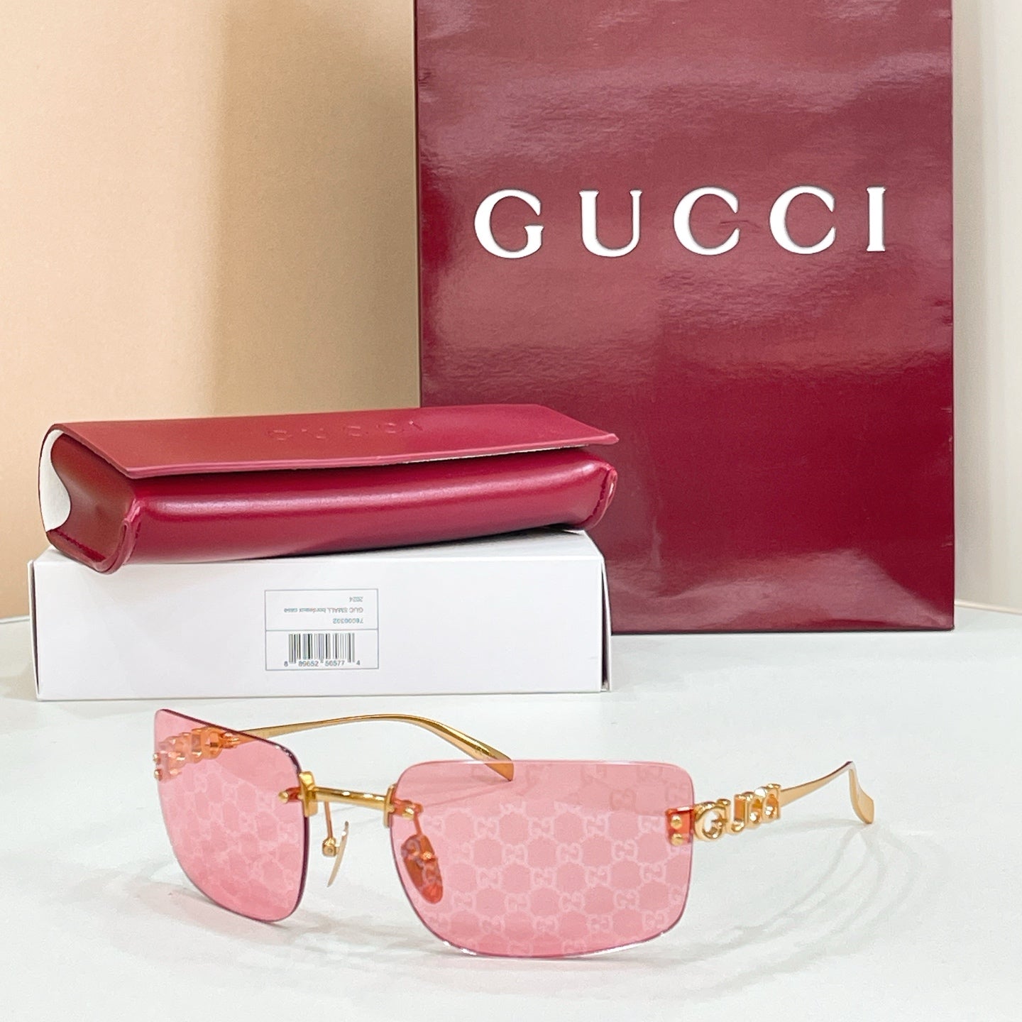 Sunglasses with pink patterned frame and pink gradient lenses