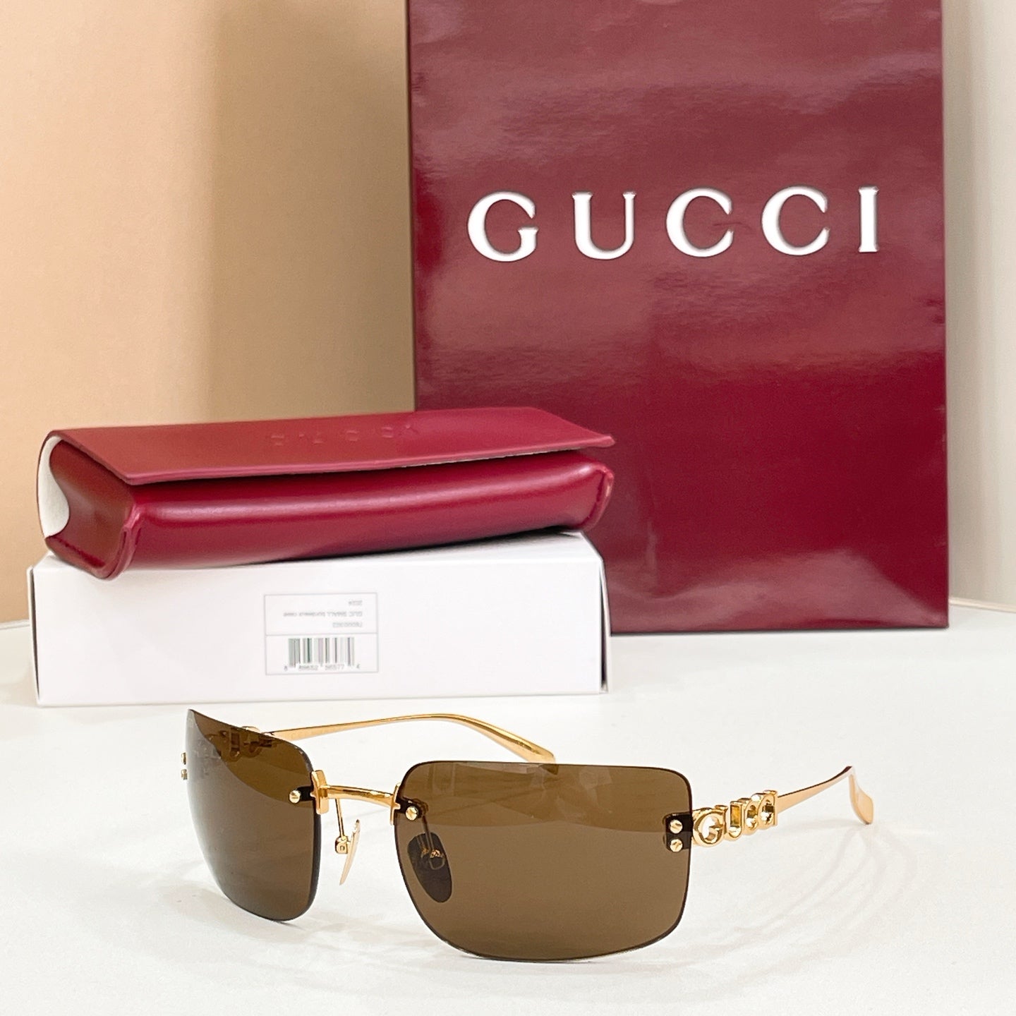 Sunglasses with gold frame and dark brown gradient lenses
