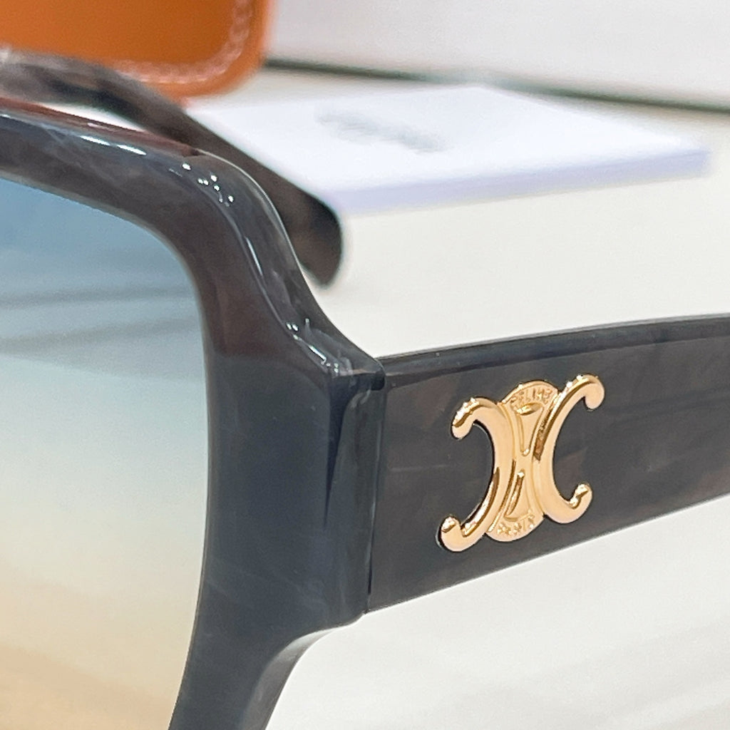 Celine glasses close-up: dark frame corner with gold logo on temple