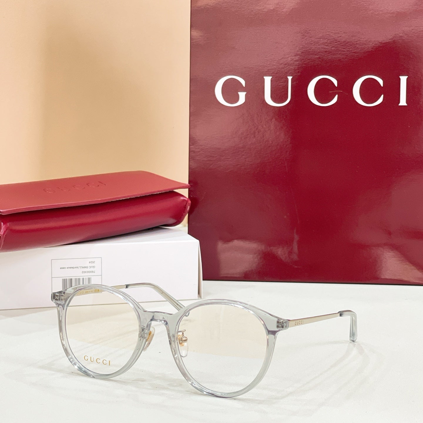 Gucci eyeglasses with round clear gray frames and clear lenses